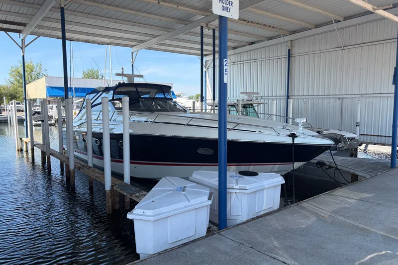 Slide: The Image of 1997 Sunseeker Camargue 51 yacht docked in a covered marina slip. - 3