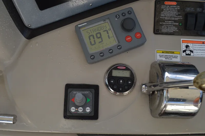 Slide: The Image of Control panel of a 2007 Sea Ray 38 Sundancer boat with navigation instruments. - 13