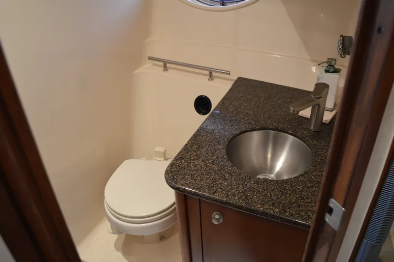 Slide: The Image of Bathroom interior of 2007 Sea Ray 38 Sundancer yacht with sink and toilet. - 34