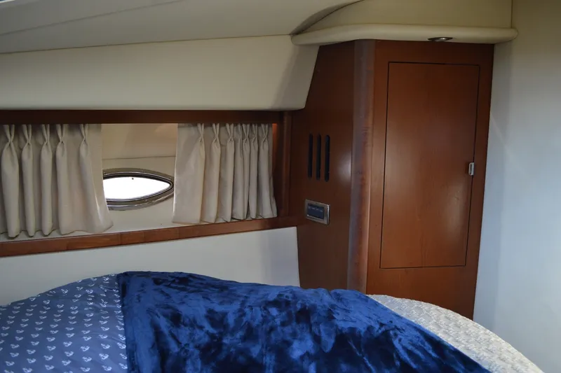 Slide: The Image of Luxurious cabin interior of 2007 Sea Ray 38 Sundancer yacht with wood accents. - 31