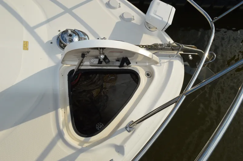 Slide: The Image of Anchor locker of 2007 Sea Ray 38 Sundancer boat with open hatch and visible ropes. - 17