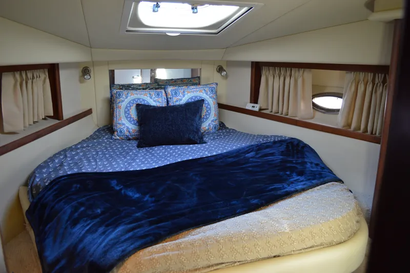 Slide: The Image of Luxurious cabin interior of 2007 Sea Ray 38 Sundancer yacht with cozy bedding. - 30