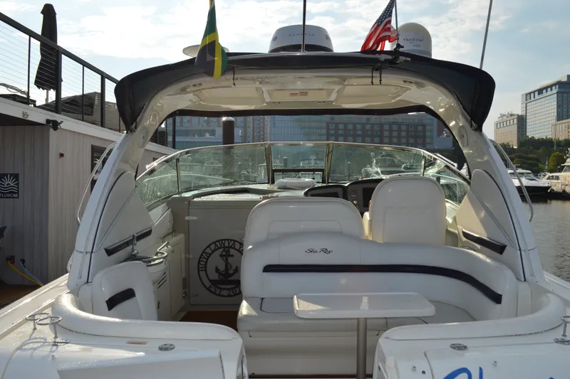 Slide: The Image of 2007 Sea Ray 38 Sundancer yacht docked, featuring spacious seating and sleek design. - 5