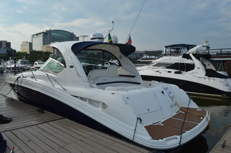 Slide: The Image of 2007 Sea Ray 38 Sundancer yacht docked at marina, featuring sleek design and modern amenities. - 3