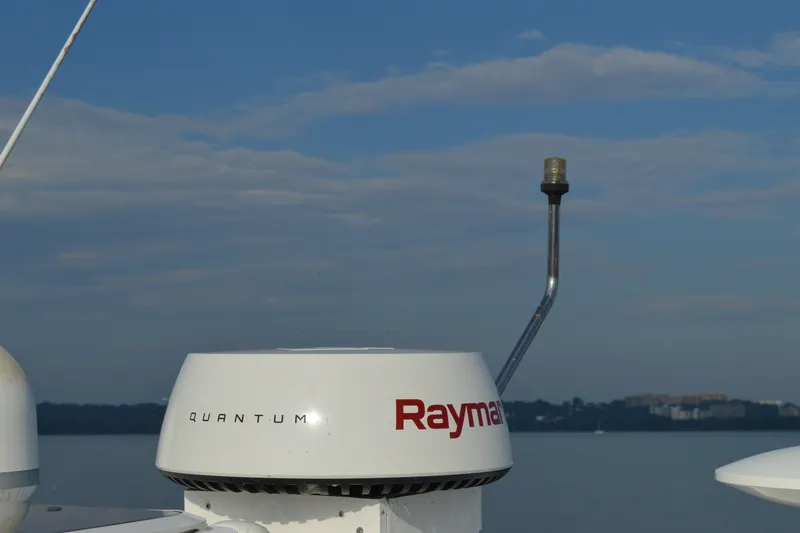 Slide: The Image of Radar equipment on a 2007 Sea Ray 38 Sundancer against a clear blue sky. - 19