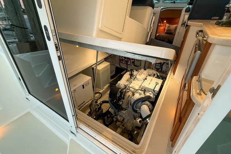 Slide: The Image of Engine room of a 2016 Back Cove 34 boat, showcasing machinery and equipment. - 42
