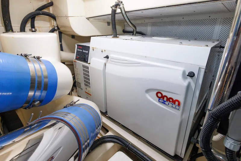 Slide: The Image of Engine room of 2010 Vicem 64 yacht featuring Onan marine generator. - 95