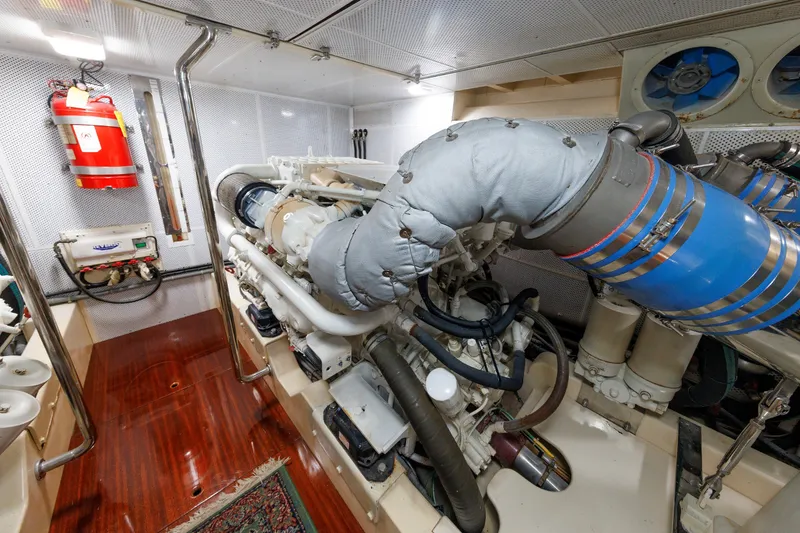 Slide: The Image of Engine room of 2010 Vicem 64 yacht, featuring machinery and fire safety equipment. - 94