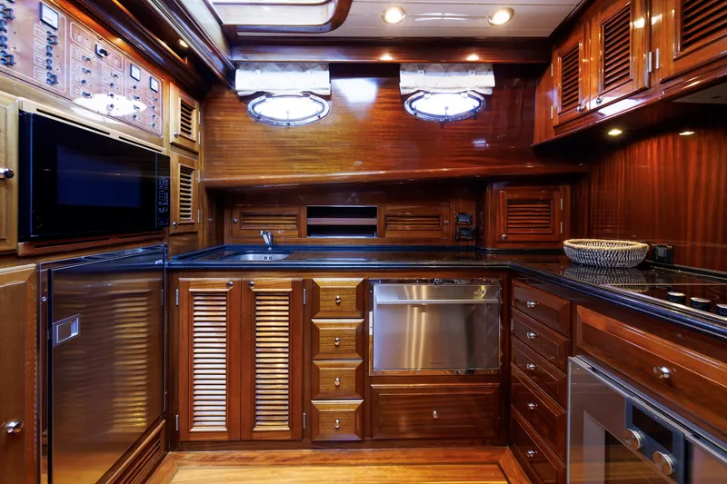 Slide: The Image of Luxurious wooden kitchen interior of 2010 Vicem 64 yacht, featuring modern appliances and elegant cabinetry. - 72