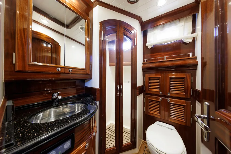 Slide: The Image of Luxurious 2010 Vicem 64 yacht bathroom with elegant wood finishes and modern fixtures. - 81