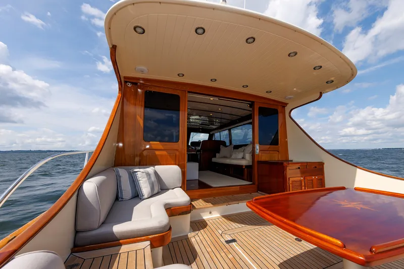 Slide: The Image of Luxurious 2010 Vicem 64 yacht with elegant wood finish and spacious outdoor seating. - 37