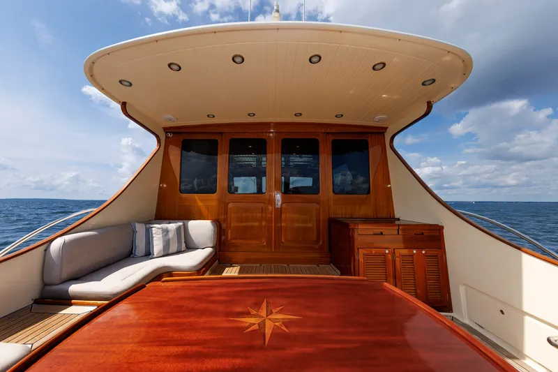 Slide: The Image of Luxurious 2010 Vicem 64 yacht deck with elegant wood finish and ocean view. - 34