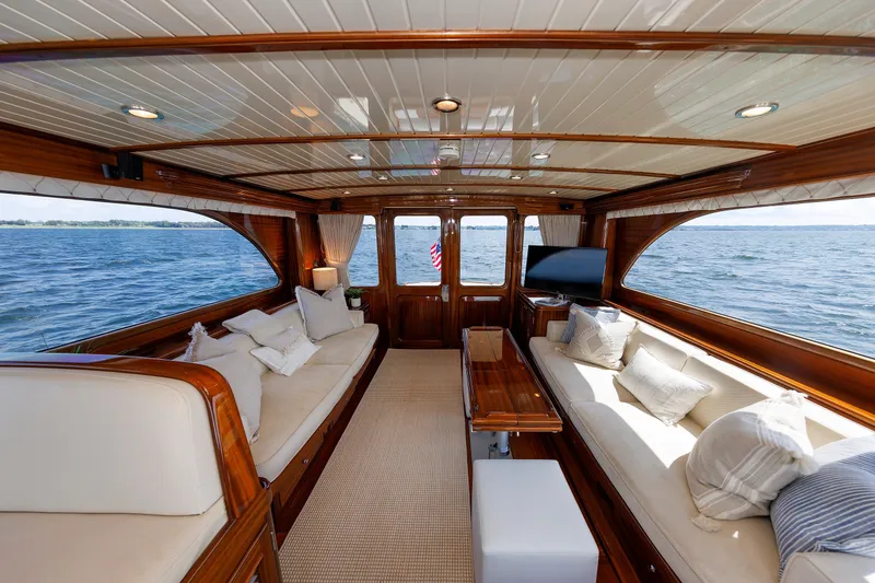 Slide: The Image of Luxurious interior of 2010 Vicem 64 yacht with elegant wood finish and plush seating. - 58