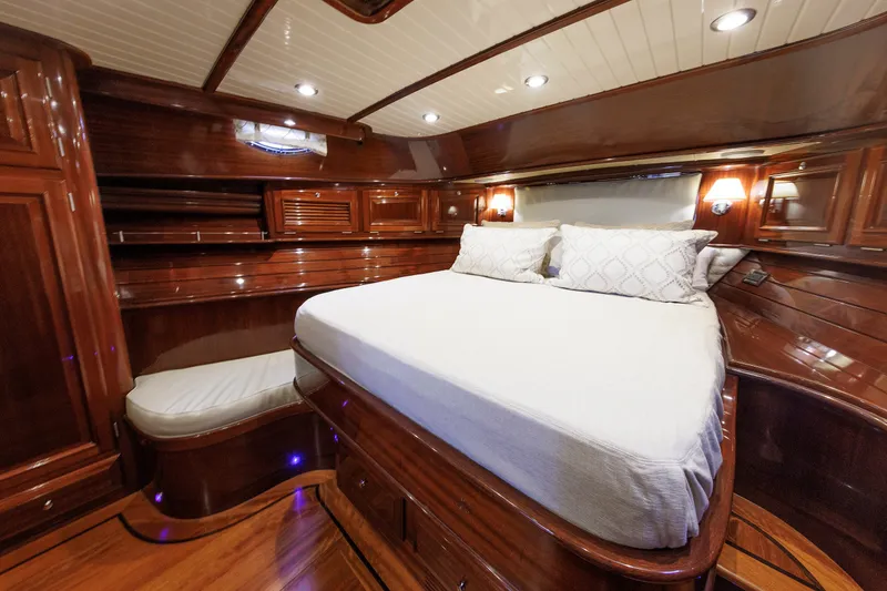 Slide: The Image of Luxurious 2010 Vicem 64 yacht cabin with elegant wood finish and cozy bedding. - 78