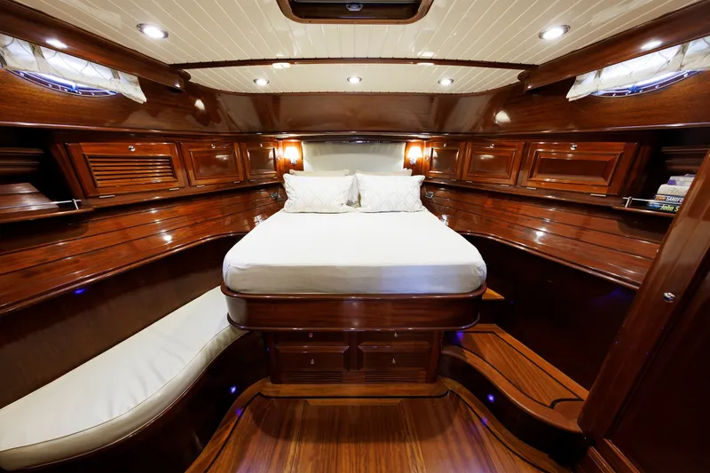 Slide: The Image of Luxurious 2010 Vicem 64 yacht cabin with elegant wood finish and cozy bedding. - 77