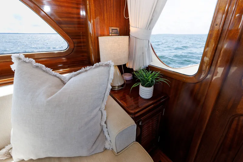 Slide: The Image of Luxurious interior of 2010 Vicem 64 yacht with ocean view, featuring elegant decor and plush seating. - 56