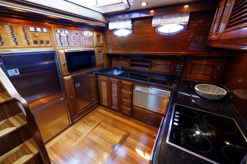 Slide: The Image of Luxurious 2010 Vicem 64 yacht kitchen with wood cabinetry and modern appliances. - 71