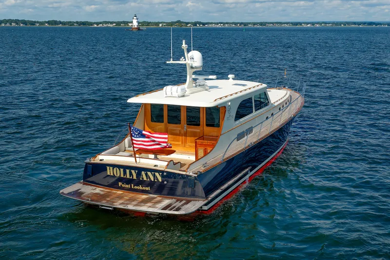 Slide: The Image of 2010 Vicem 64 yacht "Holly Ann" on open water with American flag. - 20