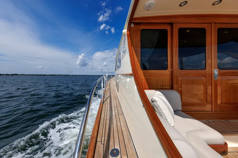 Slide: The Image of Luxurious 2010 Vicem 64 yacht cruising on open water under a clear blue sky. - 30