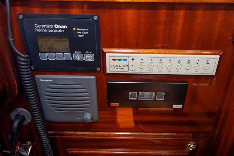 Slide: The Image of Control panel of a 2010 Vicem 64 yacht featuring Cummins Onan Marine Generator. - 66