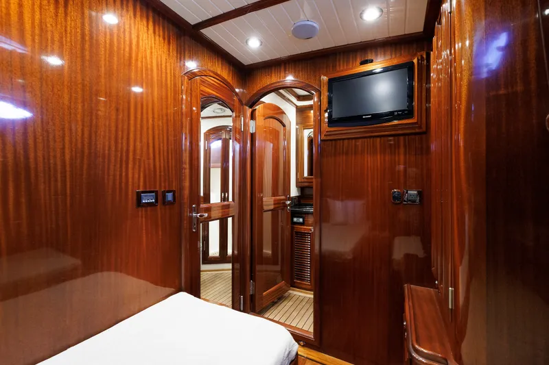 Slide: The Image of Luxurious wooden interior of 2010 Vicem 64 yacht cabin with TV and elegant lighting. - 86