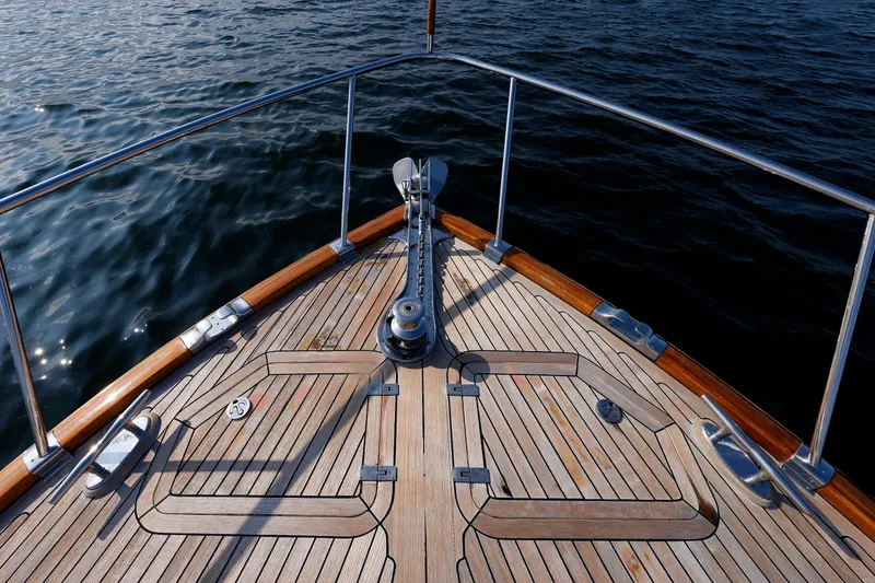 Slide: The Image of Bow of 2010 Vicem 64 yacht with teak deck and stainless steel fittings. - 28