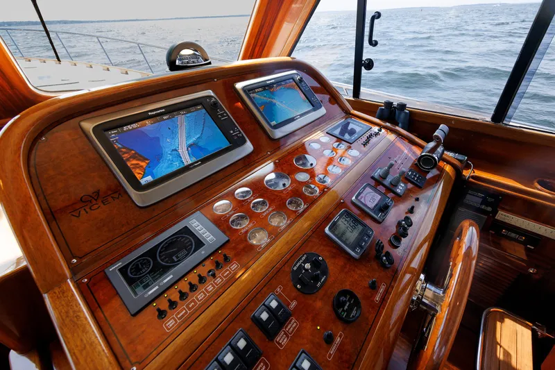 Slide: The Image of Cockpit of 2010 Vicem 64 yacht with navigation screens and controls. - 63