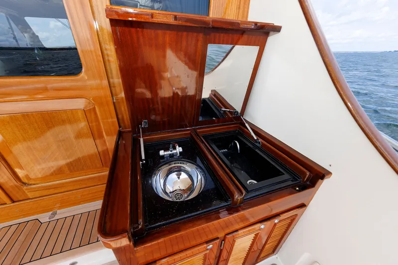 Slide: The Image of Luxurious 2010 Vicem 64 yacht with elegant wooden outdoor sink and storage. - 42