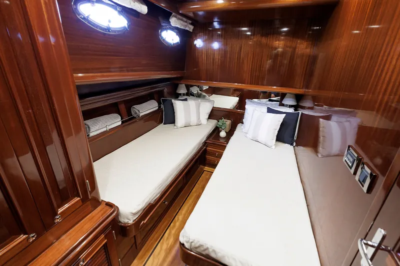 Slide: The Image of Luxurious 2010 Vicem 64 yacht cabin with twin beds and elegant wood finish. - 83