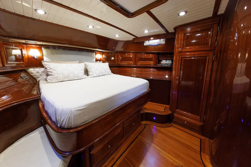 Slide: The Image of Luxurious 2010 Vicem 64 yacht cabin with polished wood interior and cozy bed. - 79