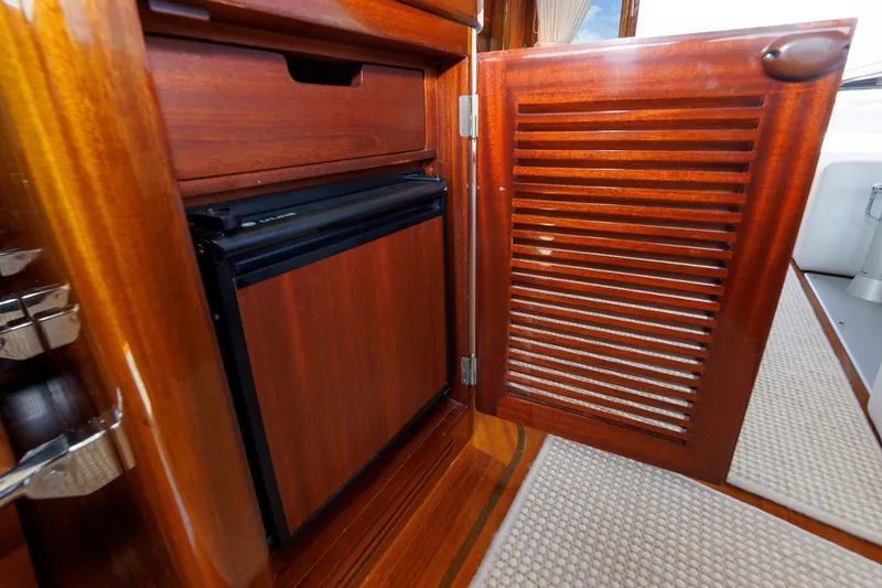 Slide: The Image of Wooden cabinet with open louvered door on a 2010 Vicem 64 yacht. - 67
