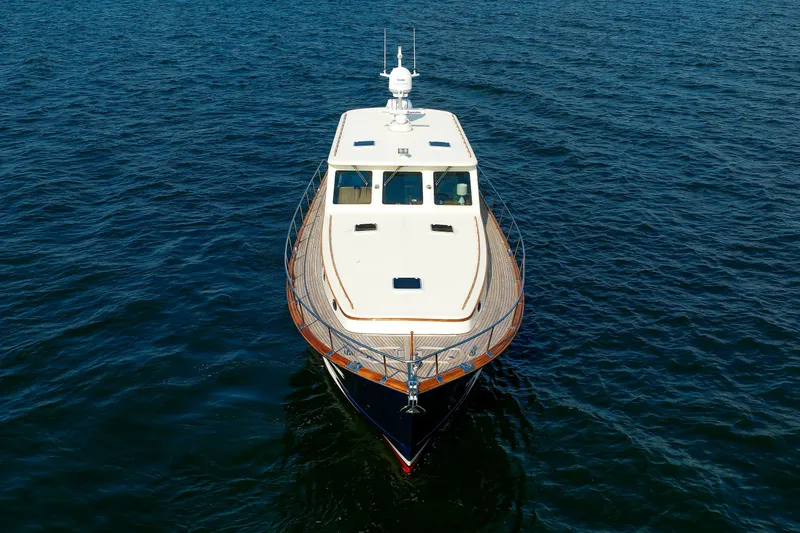 Slide: The Image of 2010 Vicem 64 yacht cruising on open water, aerial front view. - 15