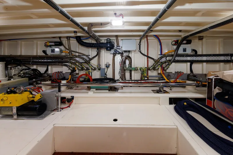 Slide: The Image of Engine room of 2010 Vicem 64 yacht, showcasing wiring and mechanical components. - 100