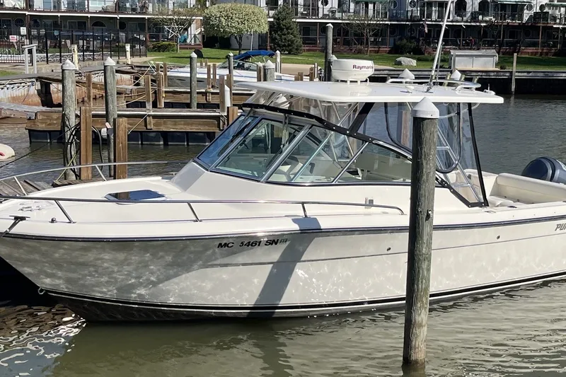The Image of 2004 Pursuit 2670 Denali LS boat docked at a marina. - 0