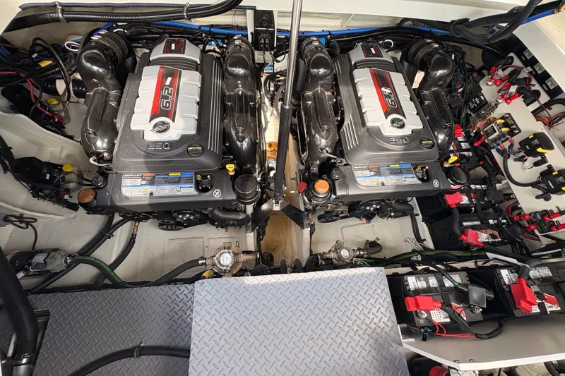 Slide: The Image of Engine room of 2025 Sea Ray Sundancer 320 with twin 6.2L engines. - 34