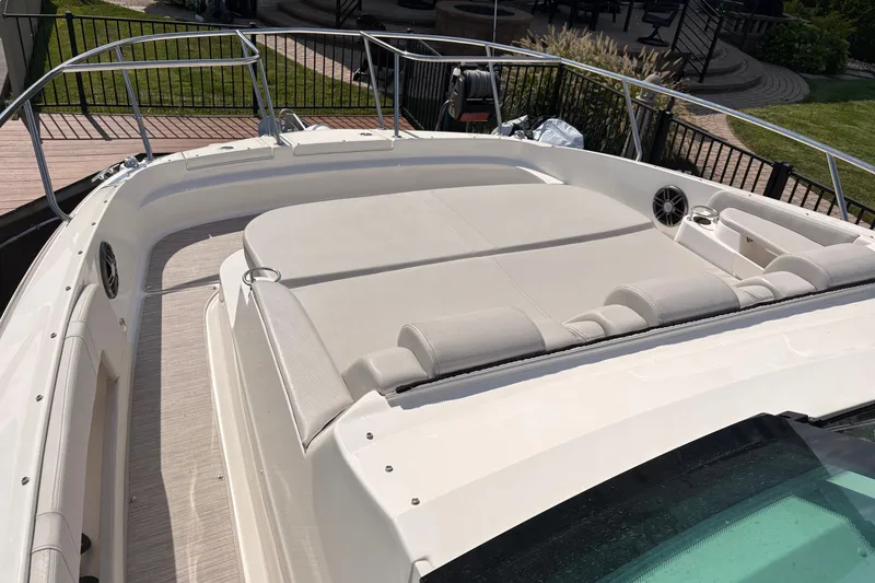 Slide: The Image of 2025 Sea Ray Sundancer 320 boat with spacious sun deck and sleek design. - 21