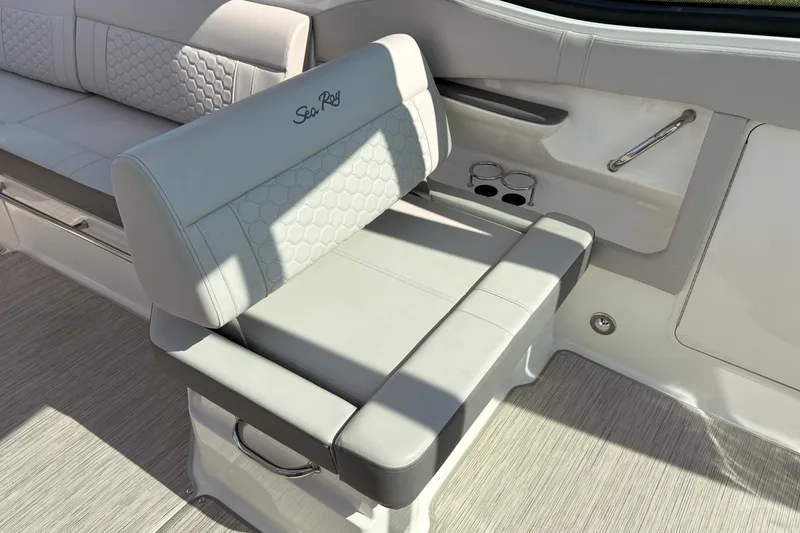 Slide: The Image of Luxurious seating on 2025 Sea Ray Sundancer 320 boat, featuring elegant design and comfort. - 18
