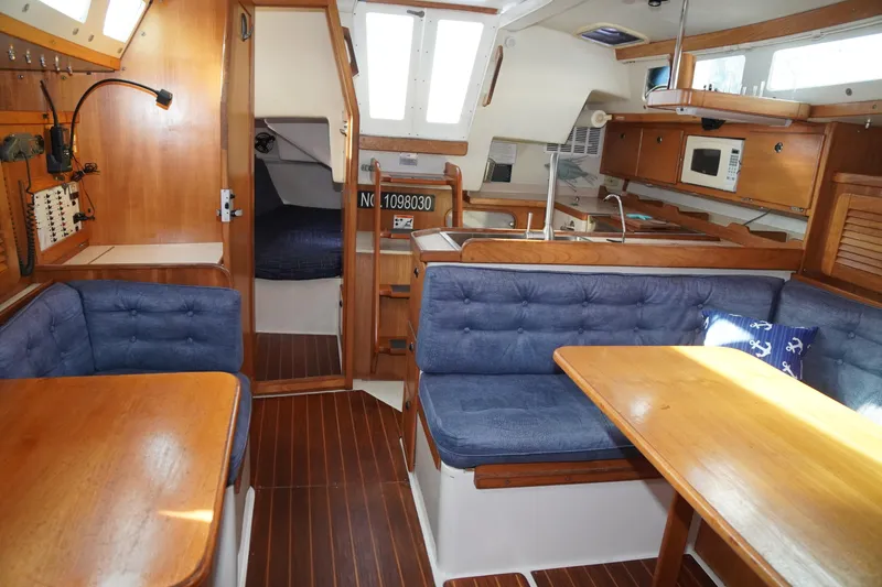 Slide: The Image of Interior of 2000 Catalina 36 MkII sailboat with wood finish and blue upholstery. - 24