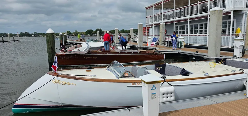 Slide: The Image of Boats docked at a marina with people on the pier, Custom M27 model, 2023. - 6