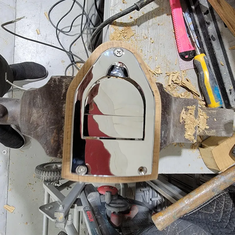 Slide: The Image of Custom M27 2023 model with polished metal component on a workbench, surrounded by tools and wood shavings. - 21