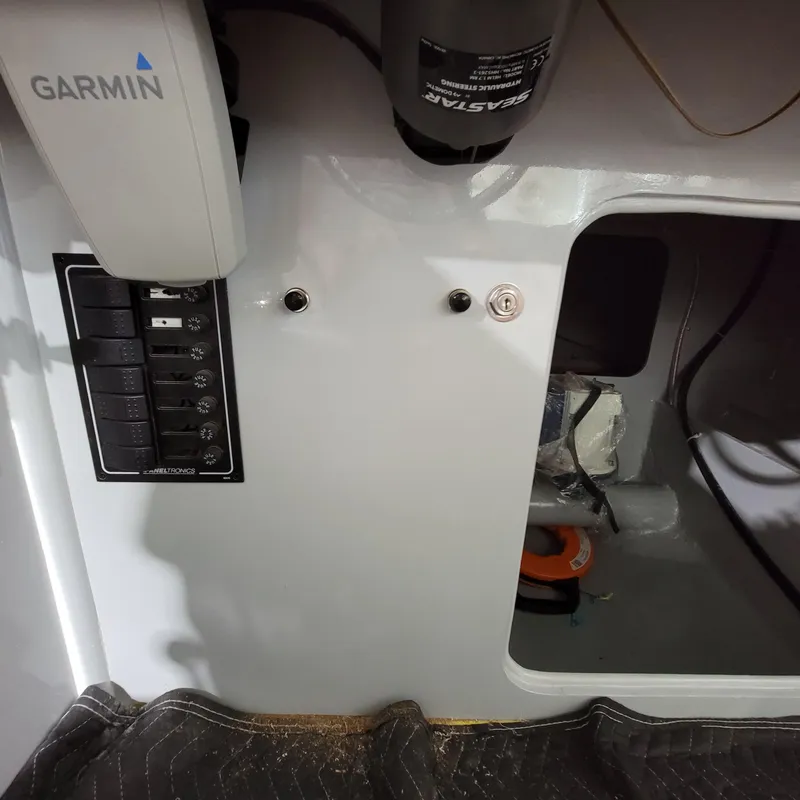 Slide: The Image of Control panel with Garmin device in a Custom M27, 2023 model. - 25