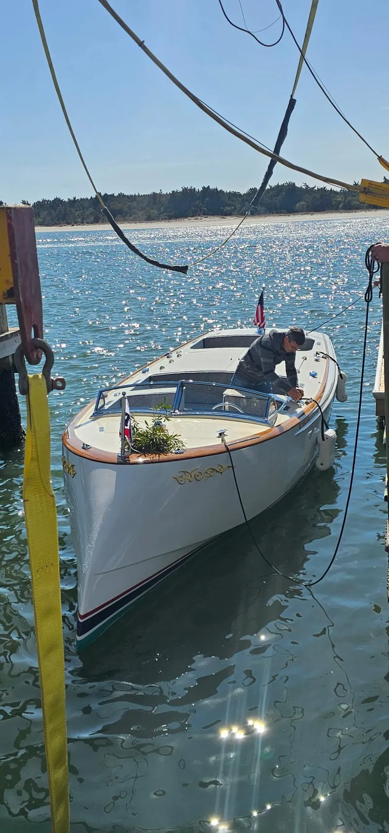 Slide: The Image of Custom M27 boat on water, 2023 model, with person onboard under sunny sky. - 31