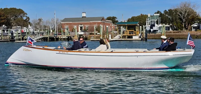 Slide: The Image of Custom M27 boat cruising on a calm waterway, 2023 model. - 5