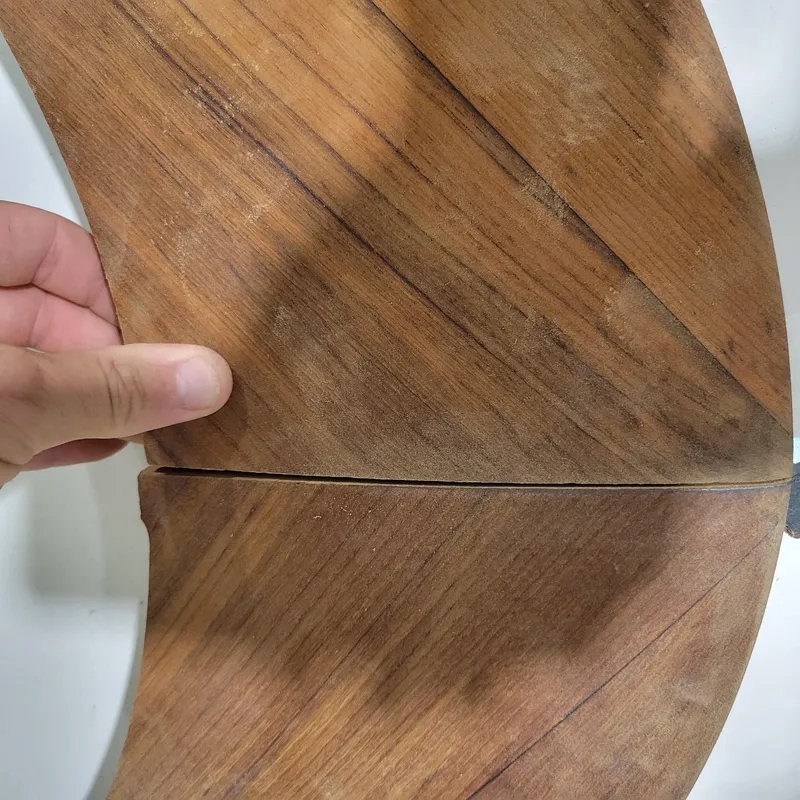 Slide: The Image of Hand holding custom wooden object with visible grain, model M27, 2023 design. - 14
