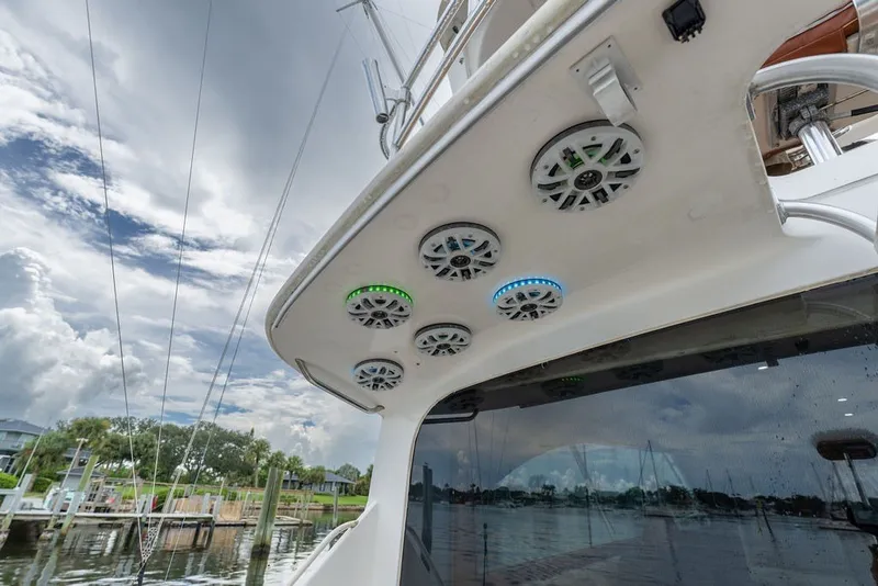 Slide: The Image of 1997 Ocean Yachts 40 Super Sport with deck speakers, docked under cloudy sky. - 36