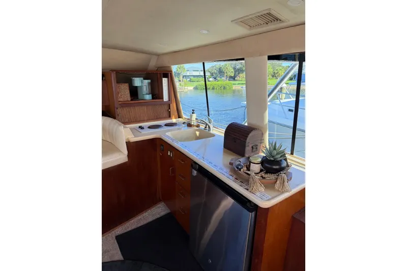 Slide: The Image of Interior of 1997 Ocean Yachts 40 Super Sport with kitchenette and scenic window view. - 45