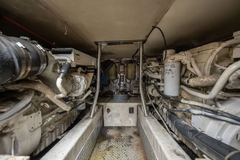 Slide: The Image of Engine room of a 1997 Ocean Yachts 40 Super Sport, showcasing mechanical components. - 75