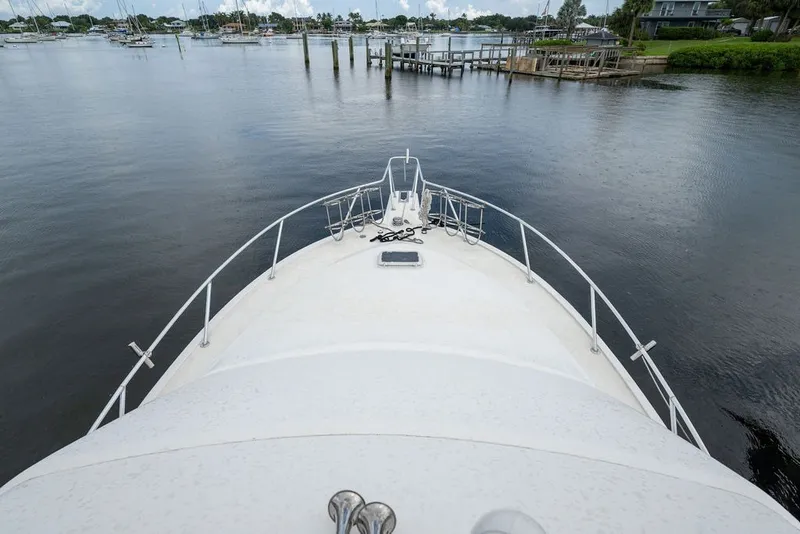 Slide: The Image of Bow view of 1997 Ocean Yachts 40 Super Sport on calm waters. - 23
