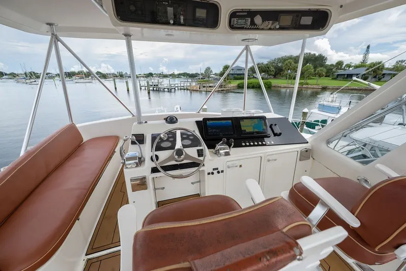 Slide: The Image of Cockpit of 1997 Ocean Yachts 40 Super Sport with leather seating and navigation equipment. - 24