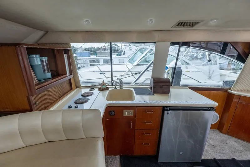 Slide: The Image of Interior of 1997 Ocean Yachts 40 Super Sport with kitchenette and seating area. - 51